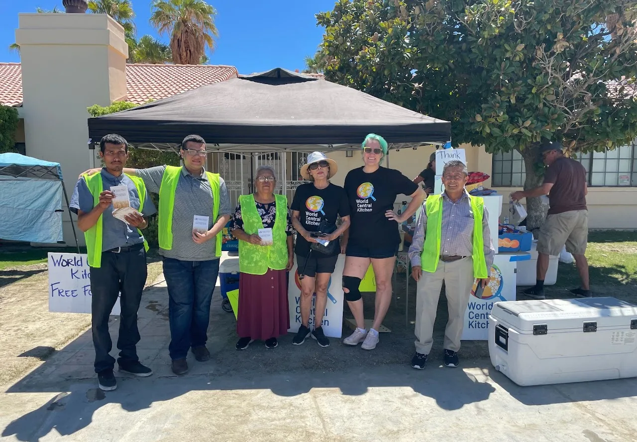 Chelsea and community volunteers sharing food and working together