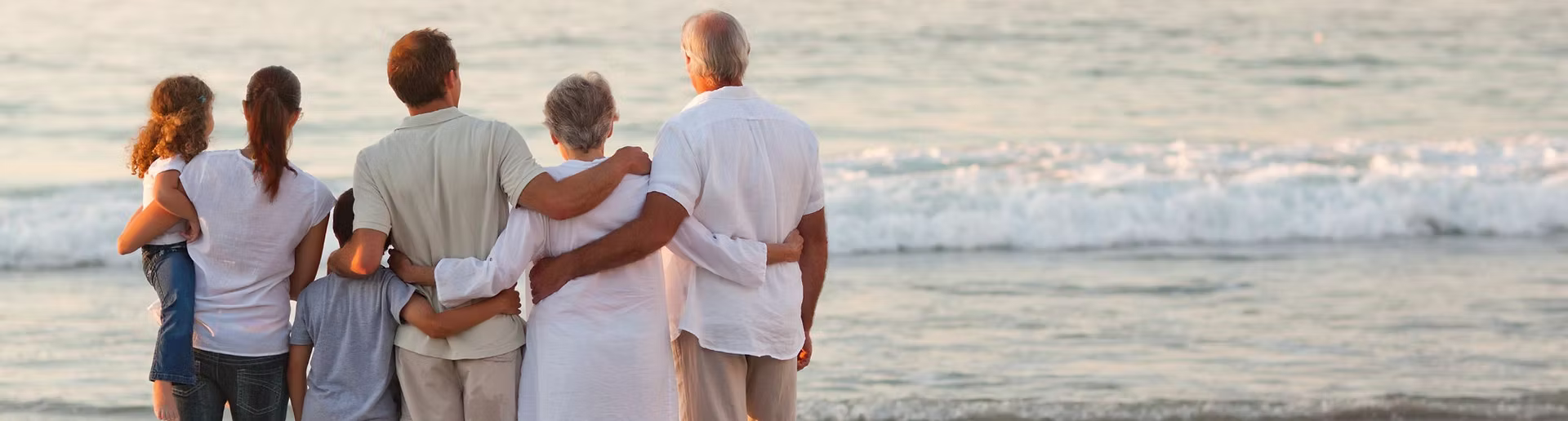 Family enjoying time together by the ocean