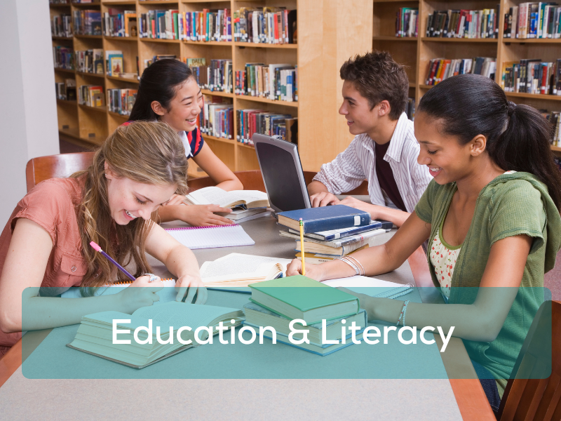 Young students reading books in a library setting