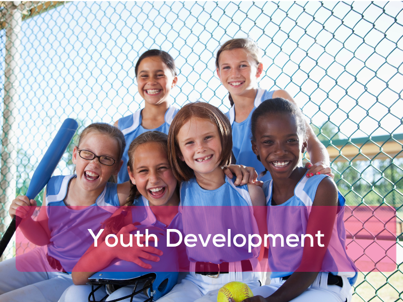 Group of youth in a sports team smiling together