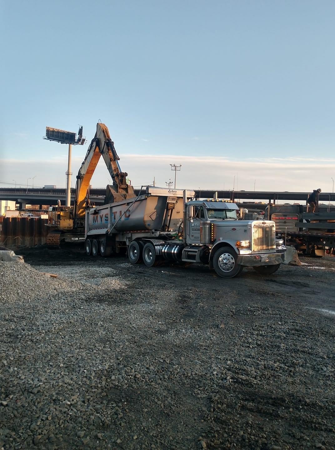 Dump Trailer #8 - Specialized construction dump trailer perfect for site work, material transport, and aggregate delivery throughout the region
