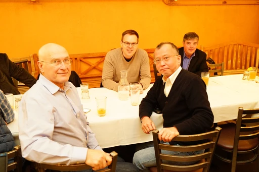 Technical discussion during a quarterly consortium meeting
