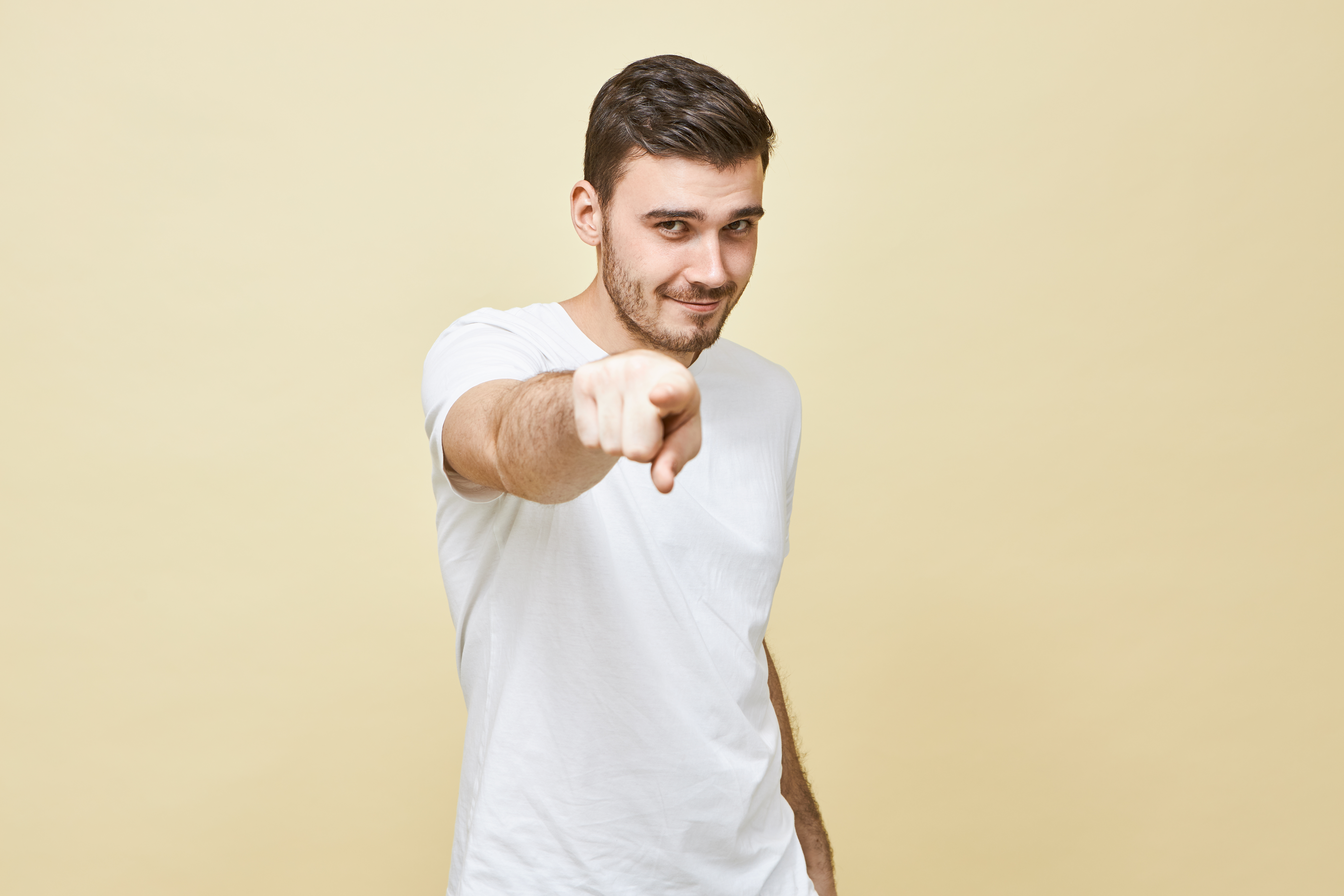 Confident business professional pointing forward with determination